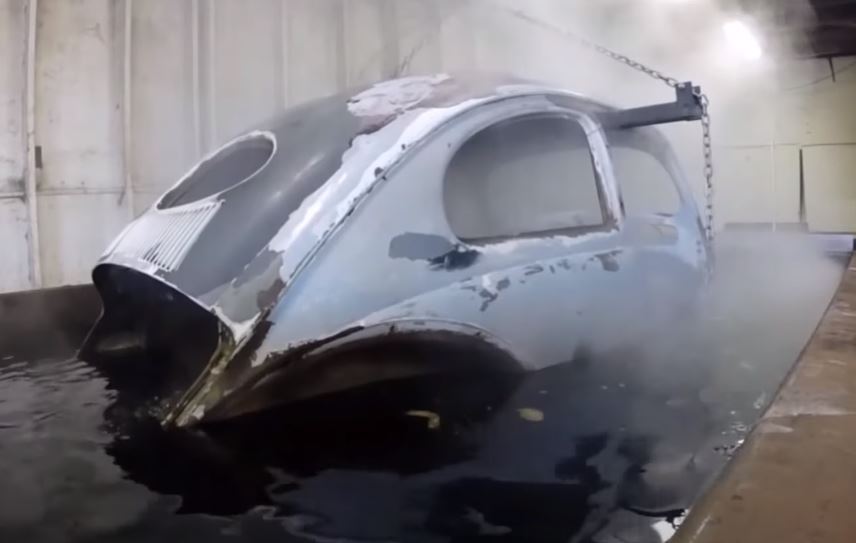 Automotive paint stripping by dipping